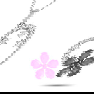 14K WHITE GOLD 0.20CT DIAMOND AND RUBY HEART AND FLOWER PENDANT NECKLACE: A heart-shaped pendant measuring 0.85 long by 0.65 wide makes this 14K White Gold necklace instantly captivating. Sweet and sophisticated, it comes complete with Ruby gemstones in a floral motif, spar