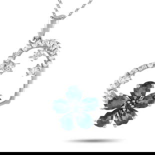 14K WHITE GOLD 0.20CT DIAMOND AND SAPPHIRE HEART AND FLOWER PENDANT NECKLACE: This 14K White Gold necklace is as charming as it is luxurious. Suspended from an 18 chain, youll find a heart shaped pendant measuring 0.85 long by 0.65 wide. Sapphire gemstones come together to crea