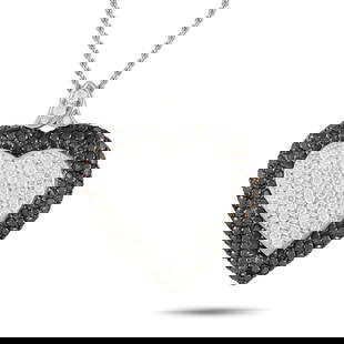GRAFF 18K WHITE GOLD 6.05CT WHITE AND BLACK DIAMOND PAVE HEART NECKLACE: This exquisite creation by Graff is a testament to the British jeweler's exceptional craftsmanship and the high quality of its diamonds. The necklace features a heart-shaped pendant measuring 1.75 inc