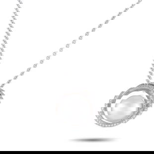 MIKIMOTO 18K WHITE GOLD 0.57CT DIAMOND AND PEARL NECKLACE: This captivating Mikimoto necklace features a stunning sense of movement. On this piece, a curved 18K White Gold pendant measuring 1.0 long by 0.88 wide is suspended from a 16 chain. A singular 13.5mm