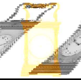 BRASS & ENAMEL GILT FRENCH CARRIAGE TABLE CLOCK: Intricately crafted in gilt brass, here is a fine French carriage clock from the late 19th to early 20th century. This analog timekeeper of a discernible style features heavily decorated columns, orna