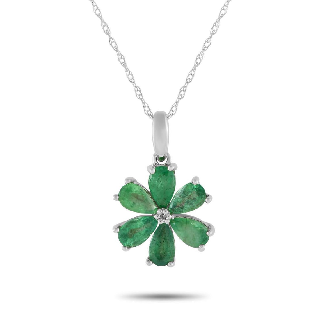 14K WHITE GOLD 0.01CT DIAMOND AND EMERALD FLOWER NECKLACE: Blooming year-round, this flower necklace is ready to polish your looks no matter the season. The necklace features an 18 cable chain in 14K white gold, holding a 0.75 by 0.50 flower-shaped pendant wi