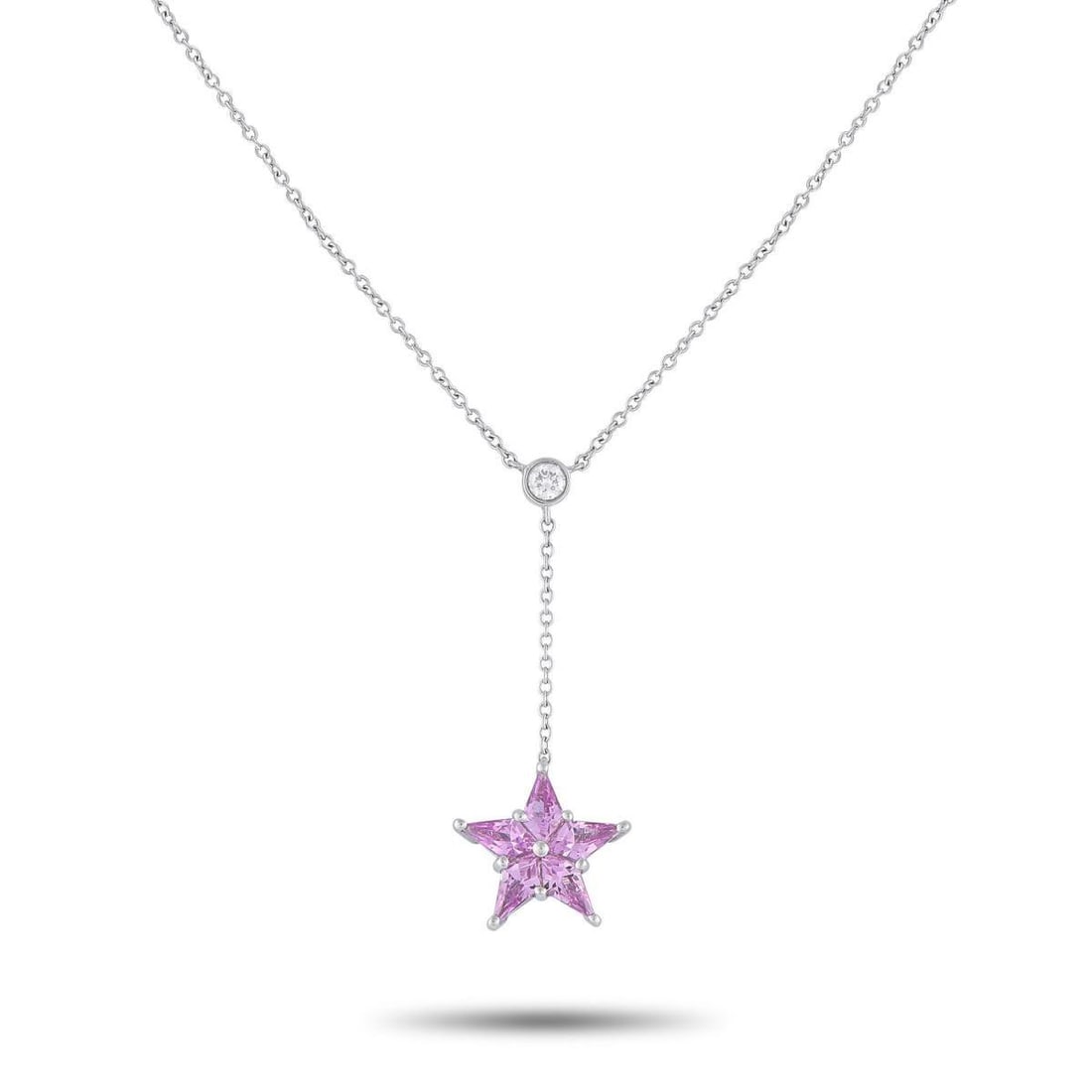 TIFFANY & CO. PLATINUM DIAMOND AND PINK SAPPHIRE STAR NECKLACE: Rendered in 950 platinum, this necklace features a fine chain punctuated with a bezel-set diamond. A delicate star motif gently drops from the brilliant stone through a short, delicate chain. Kite-sha
