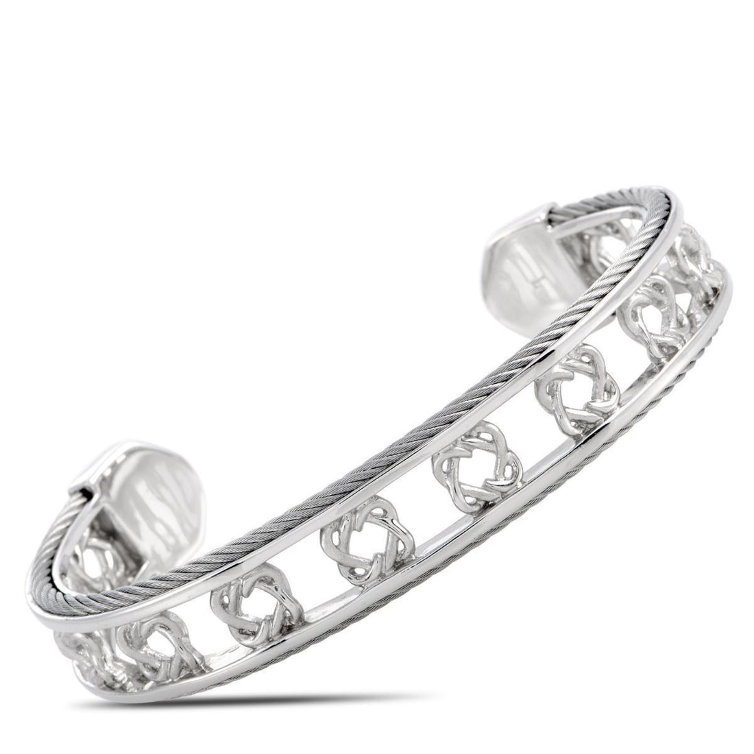 CHARRIOL HEART TO HEART STERLING SILVER BANGLE BRACELET SIZE LARGE: The Charriol Heart to Heart bracelet is crafted from sterling silver and weighs 25.2 grams, measuring 7.85 in length and 2.50 in diameter.This jewelry piece is offered in brand new condition and inclu