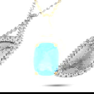 14K YELLOW GOLD 0.13CT DIAMOND AND BLUE TOPAZ NECKLACE: Marked with an exquisite sky blue gemstone, this diamond and blue topaz necklace is something you'll find yourself reaching for on special days. The necklace features a splitting bail that continues t