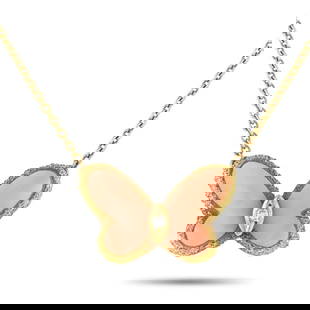 VAN CLEEF & ARPELS PAPILLON 18K YELLOW GOLD DIAMOND AND CORAL NECKLACE: This Van Cleef & Arpels Papillon necklace is equal parts charming and sophisticated. Suspended from a 16 chain, the butterfly pendant comes to life thanks to textured metalwork and Coral accents. A si