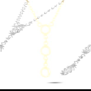 14K YELLOW GOLD 0.15CT DIAMOND NECKLACE: This necklace is crafted from 14K yellow gold and weighs 1.4 grams. It is presented with a 15 chain and boasts a pendant that measures 0.68 in length and 0.13 in width. The necklace is set with diamon