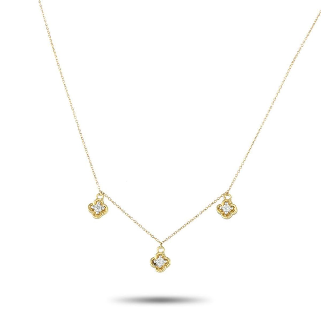 14K YELLOW GOLD 0.15CT DIAMOND STATION NECKLACE: A simple, sophisticated design makes this 14K Yellow Gold necklace an elegant accessory that will complement any ensemble. Suspended from a delicate 18 chain, a trio of quatrefoil pendants catch the l
