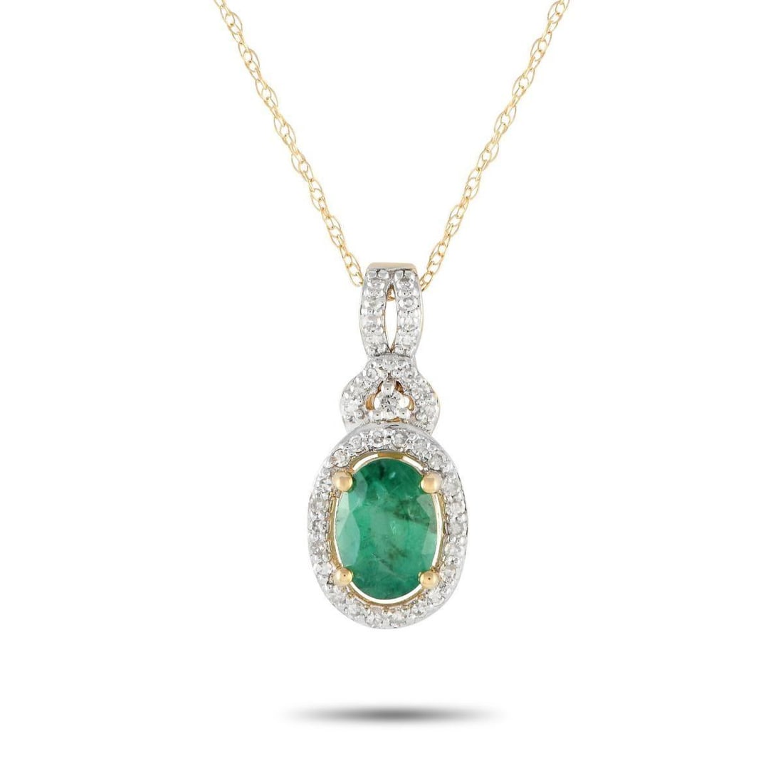 14K YELLOW GOLD 0.15CT DIAMOND AND EMERALD NECKLACE: A classic piece that can be your new everyday piece. This 14K yellow gold necklace features a delicate cable chain measuring 18 inches long. It features a split-style bail traced with diamonds. The go