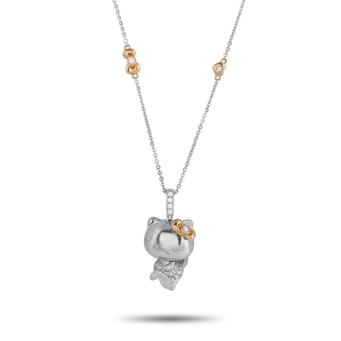 SANRIO HELLO KITTY 18K WHITE AND ROSE GOLD 0.57CT DIAMOND PENDANT NECKLACE: The Sanrio brands most iconic character makes a statement on this exquisite 18K White Gold necklace. Charming and elegant, the Hello Kitty pendant measures 1.25 long by 0.75 wide and is suspended from