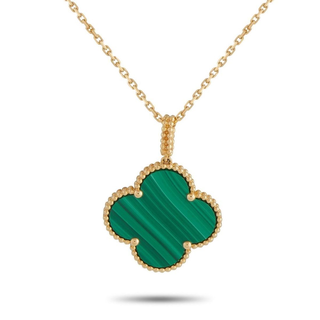 VAN CLEEF & ARPELS MAGIC ALHAMBRA 18K YELLOW GOLD MALACHITE NECKLACE: A vibrant green Malachite stone makes this Van Cleef & Arpels Magic Alhambra necklace instantly eye-catching. Crafted from 18K Yellow Gold, a dramatic 35 chain allows you to wear it long or double the