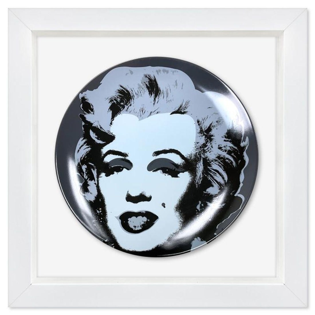 Andy Warhol (1928-1987), "Marilyn (Black)" Framed Limoges Porcelain Plate.: Marilyn (Black) is a Limoges porcelain plate bearing the plate signature inverso of Andy Warhol (1928-1987). This plate is custom framed and floated on linen. Measures approx. 13.5" x 13.5" (frame), 8