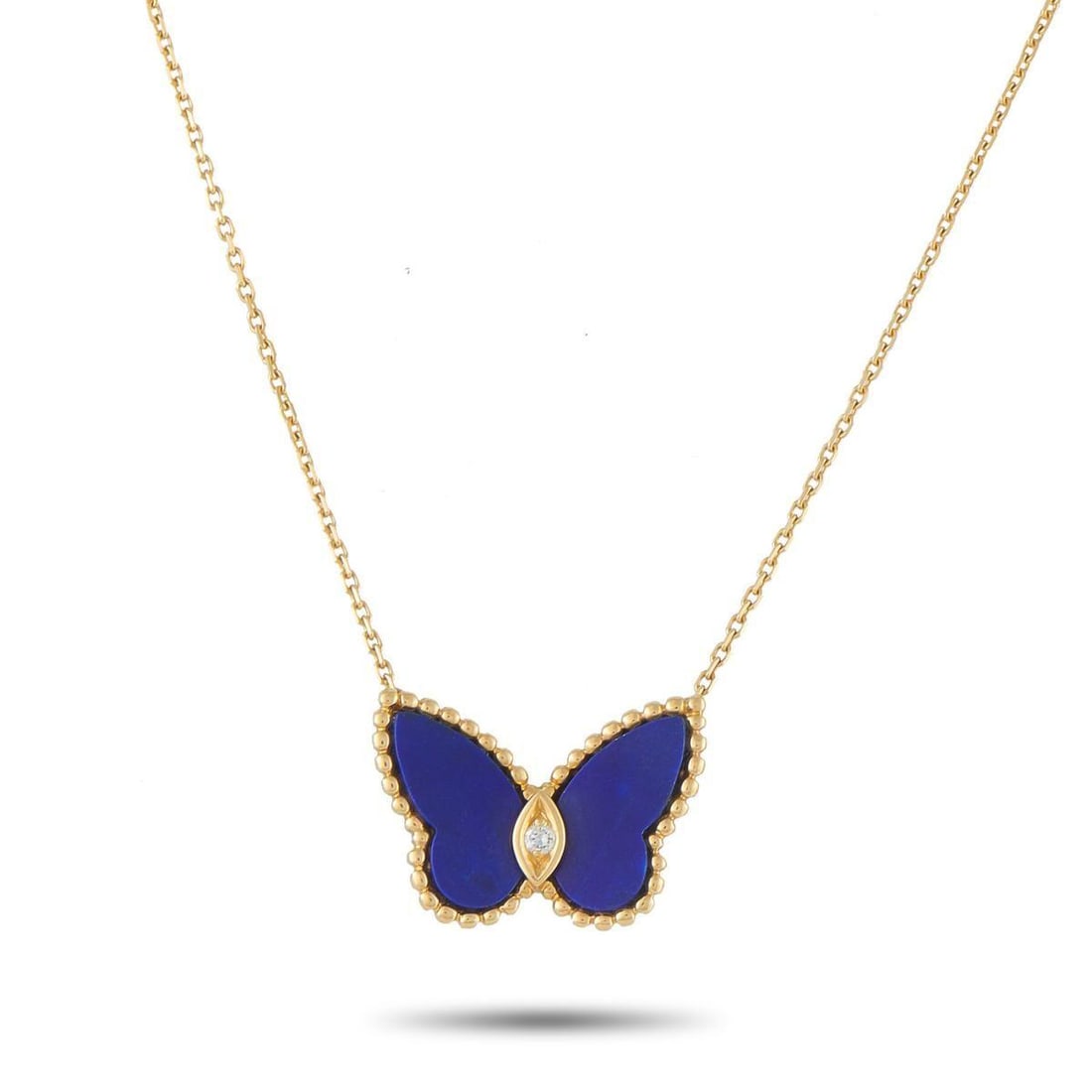 VAN CLEEF & ARPELS VINTAGE PAPILLON 18K YELLOW GOLD DIAMOND AND LAPIS NECKLACE: This vintage Van Cleef & Arpels Papillon necklace is poised to add a stylish pop of color to any ensemble. Set in 18K Yellow Gold, the charming butterfly pendant comes alive thanks to blue Lapis wings