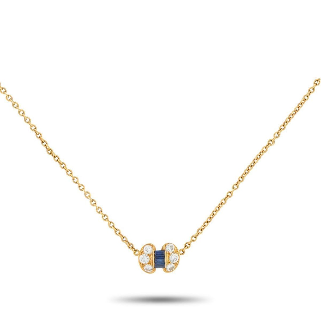 VAN CLEEF & ARPELS VINTAGE 18K YELLOW GOLD 0.46CT DIAMOND AND SAPPHIRE NECKLACE: This Van Cleef & Arpels necklace showcases the brand's focus on sophisticated minimalism. Suspended from its delicate gold chain is a tiny pendant that takes the shape of a chic, stylized bow. The pen