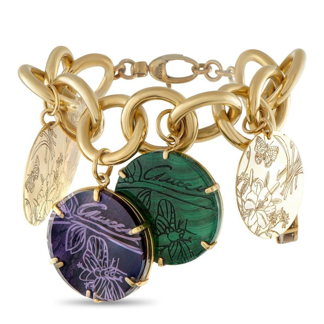 GUCCI FLORA 18K YELLOW GOLD SAINT TROPEZ MULTI-STONE CHARM BRACELET: Gucci's Saint-Tropez charm bracelet makes an impression the moment it's clasped on. At 88.5 grams, it feels solid in the hand and unmistakable on the wrist. Oversized disc charms with a floral motif h