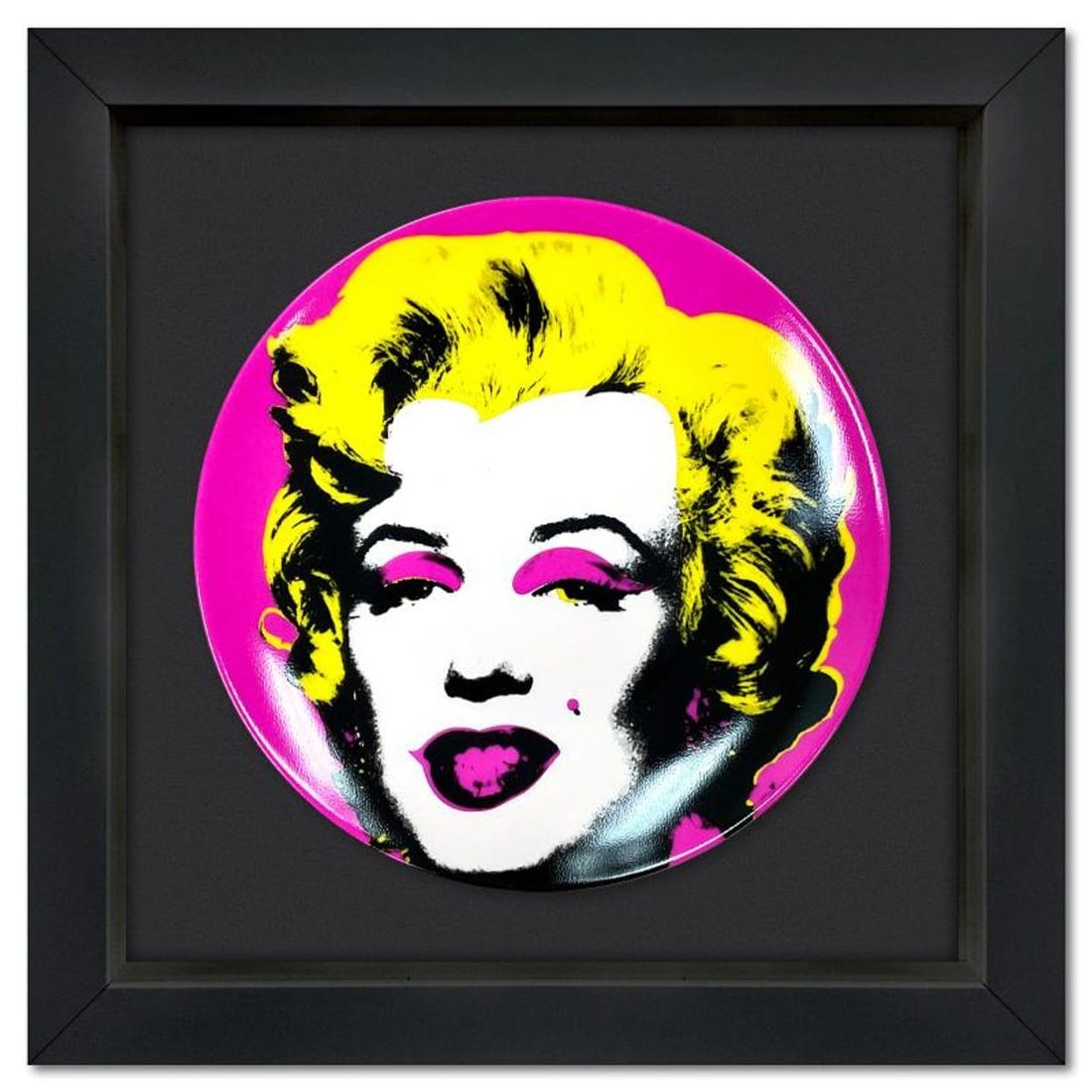 Andy Warhol (1928-1987), "Marilyn (Pink)" Framed Limoges Porcelain Plate.: Marilyn (Pink) is a Limoges porcelain plate bearing the plate signature inverso of Andy Warhol (1928-1987). This plate is custom framed and floated on linen. Measures approx. 13.5" x 13.5" (frame), 8.