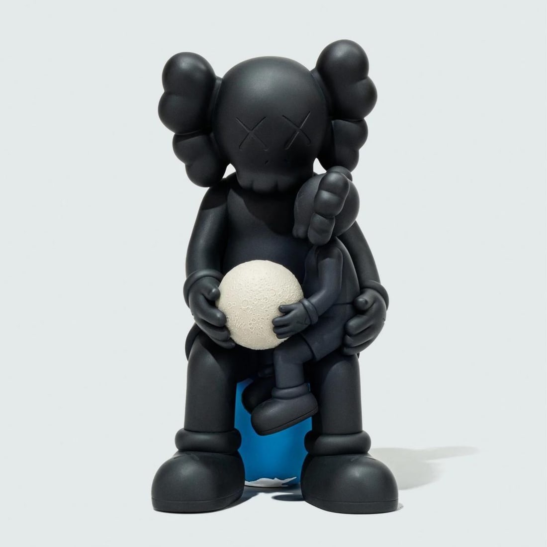 Kaws- Vinyl Figure "Holiday Thailand- Black": Artist: Kaws. Medium: Vinyl Figure. Title: Holiday Thailand- Black. Size: 11" x 6.7". Additional: Size: 11 x 5.9 x 6.7 inch. Glow in the dark. Comes in original box. Reference#: 86478.