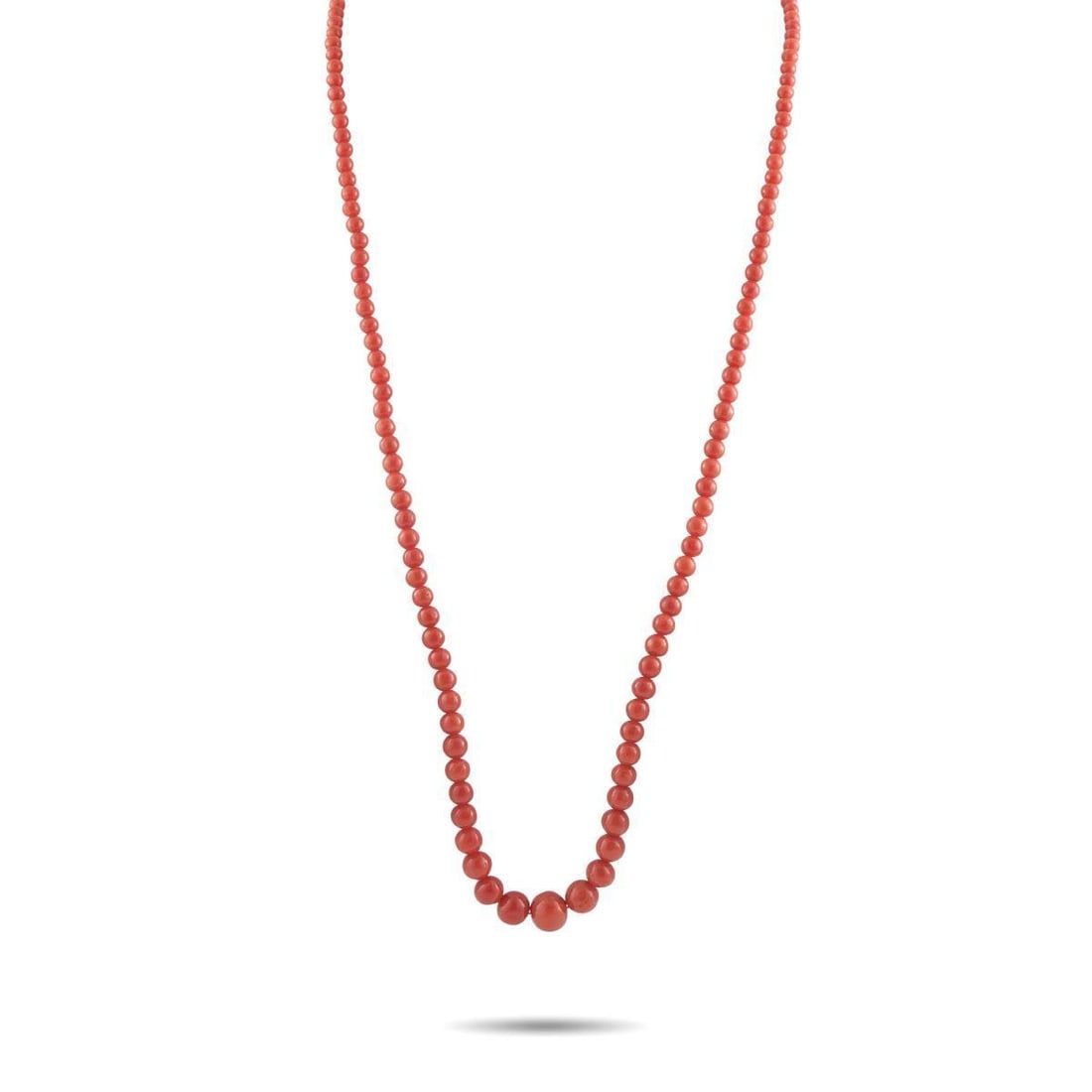 BUCCELLATI 18K WHITE AND YELLOW GOLD CORAL NECKLACE: A series of Coral beads make this vibrant Buccellati necklace impossible to ignore. Bold and incredibly dramatic, it measures 27 long and includes a detailed clasp crafted from a combination of 18K Wh