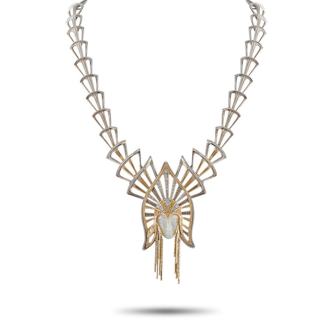 ERTE 14K YELLOW GOLD, SILVER MOTHER OF PEARL NECKLACE: A regal female figure makes a statement at the center of this Erte necklace. The womans face is crafted from Mother of Pearl but its her glistening, gemstone encrusted headdress that makes this piece