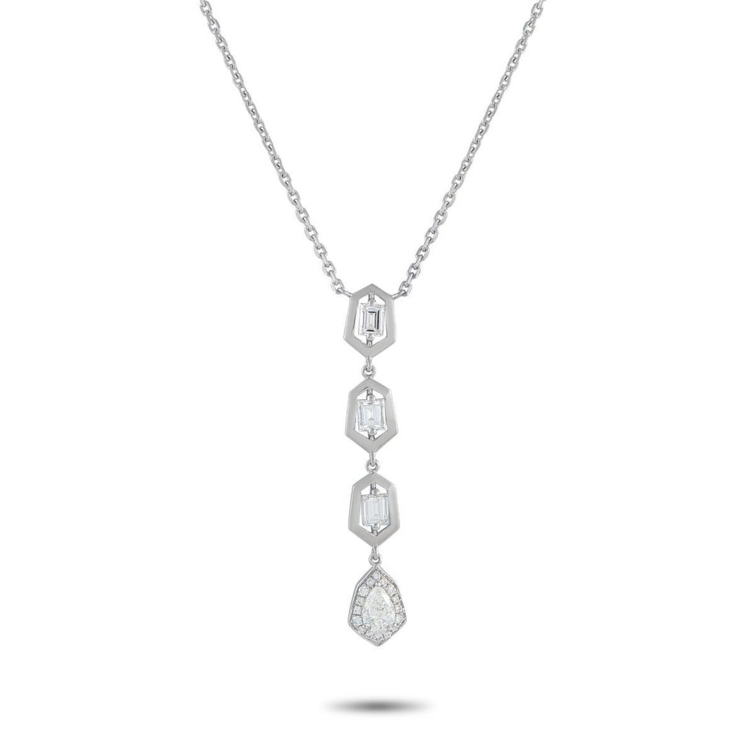 18K WHITE GOLD 1.25CT DIAMOND GEOMETRIC DROP NECKLACE: A modern drop necklace in 18K white gold, where geometry meets sparkle in a vertical flow. The pendant begins with three step-cut diamonds, each encased in a hexagonal frame. These stones guide the ey