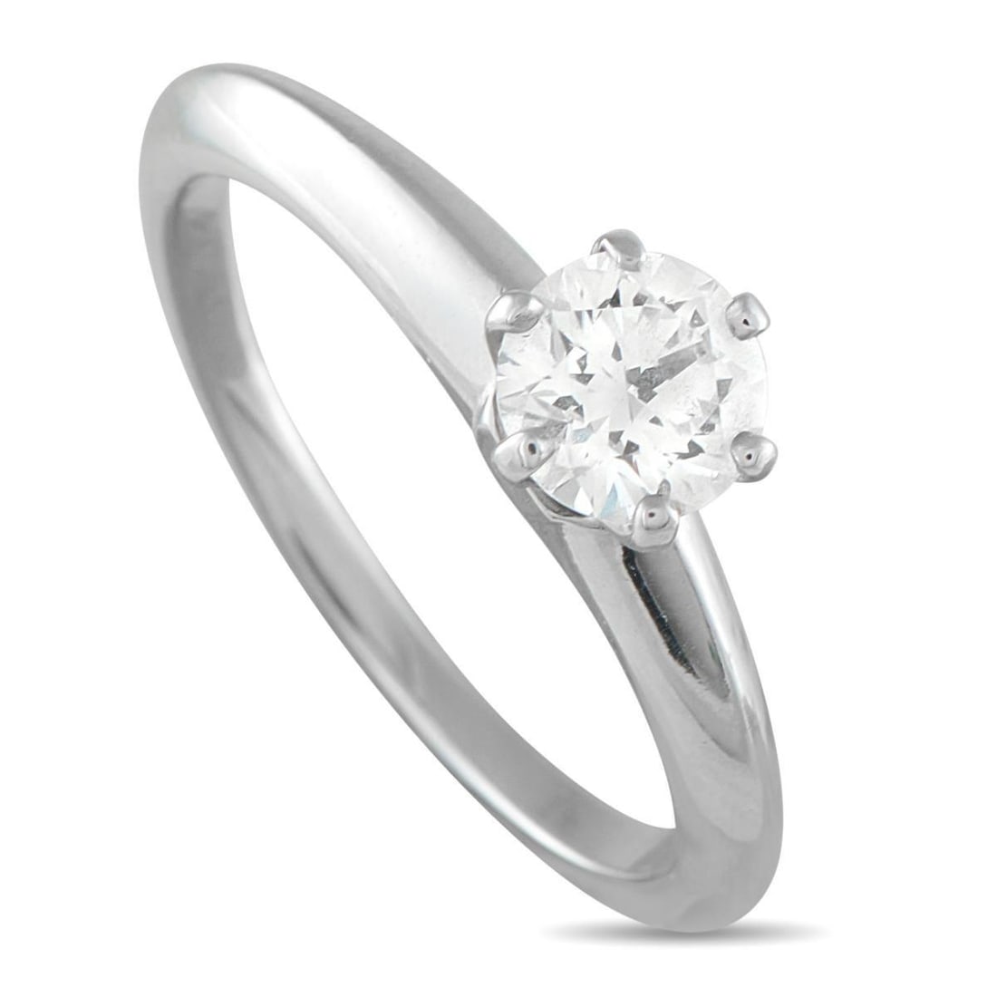 TIFFANY & CO. PLATINUM 0.61CT DIAMOND ENGAGEMENT RING: This impeccably crafted Tiffany & Co. Diamond solitaire engagement ring will never go out of style. At the center of the simple Platinum setting, a round-cut 0.61 carat Diamond provides endless sparkl