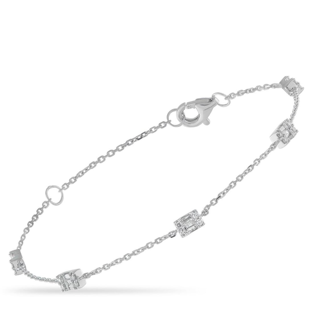 14K WHITE GOLD 0.35CT DIAMOND BRACELET: Diamond clusters with a total weight of 0.35 carats add effortless sparkle to this simple, elegant bracelet. Crafted from 14K White Gold, it measures 6.75 long and comes complete with secure lobster c