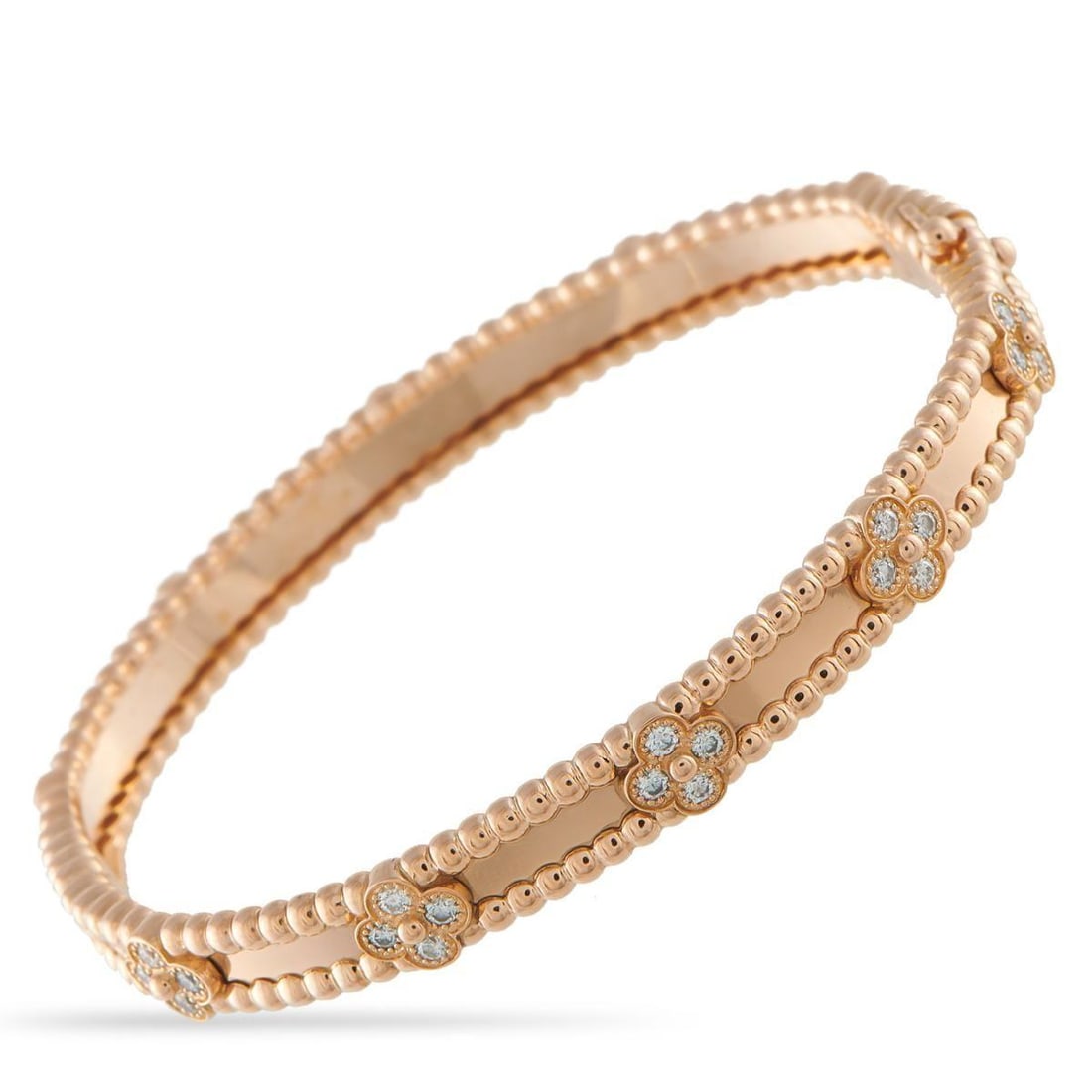 VAN CLEEF & ARPELS PERLEE 18K ROSE GOLD BRACELET SIZE SMALL: Beaded elements make this Van Cleef & Arpels Perlee bracelet sleek, elegant, and incredibly luxurious. Crafted from opulent 18K Rose Gold, the luxury brands iconic clover motif makes a statement thank