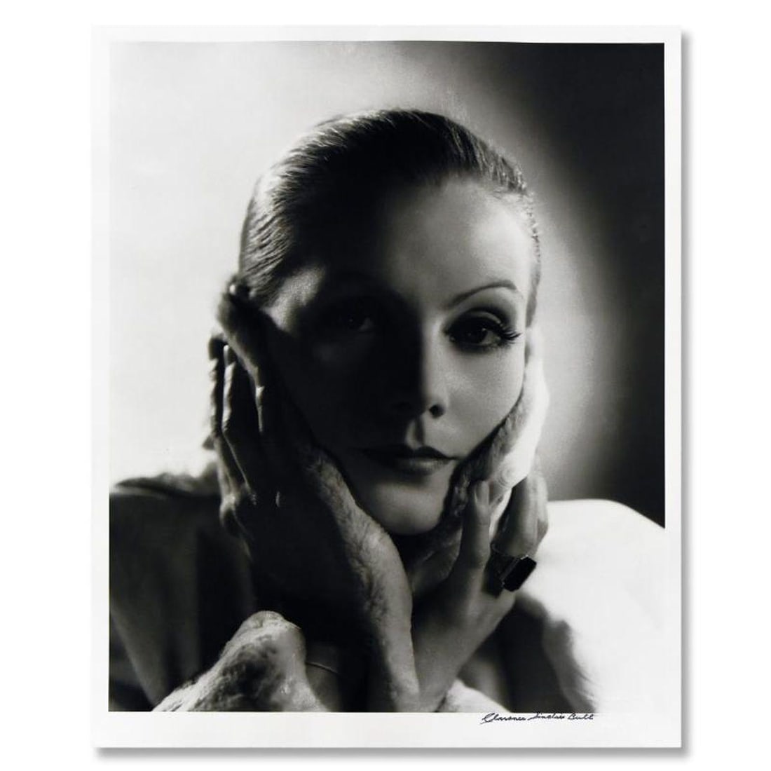 Clarence Sinclair Bull (1895-1979), "Greta Garbo" Limited Edition Photograph, Numbered and Stamp: Greta Garbo is a limited edition photograph on paper by Clarence Sinclair Bull (1895-1979), numbered and stamp signed by the estate. This photograph is from the original negative. This piece bears inv