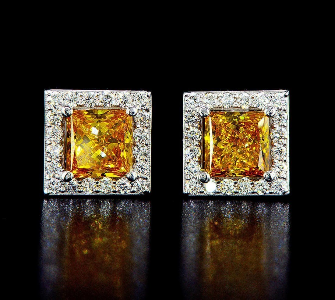 14kt White Gold 2.31ctw Diamond Earrings: One pair of 14k white gold earrings (14k stamped), each set with one center lab grown diamond and small lab grown diamonds around and on the sides. Jewelry Weight: 2.98Grs Total Diamonds Weight: 2.31C