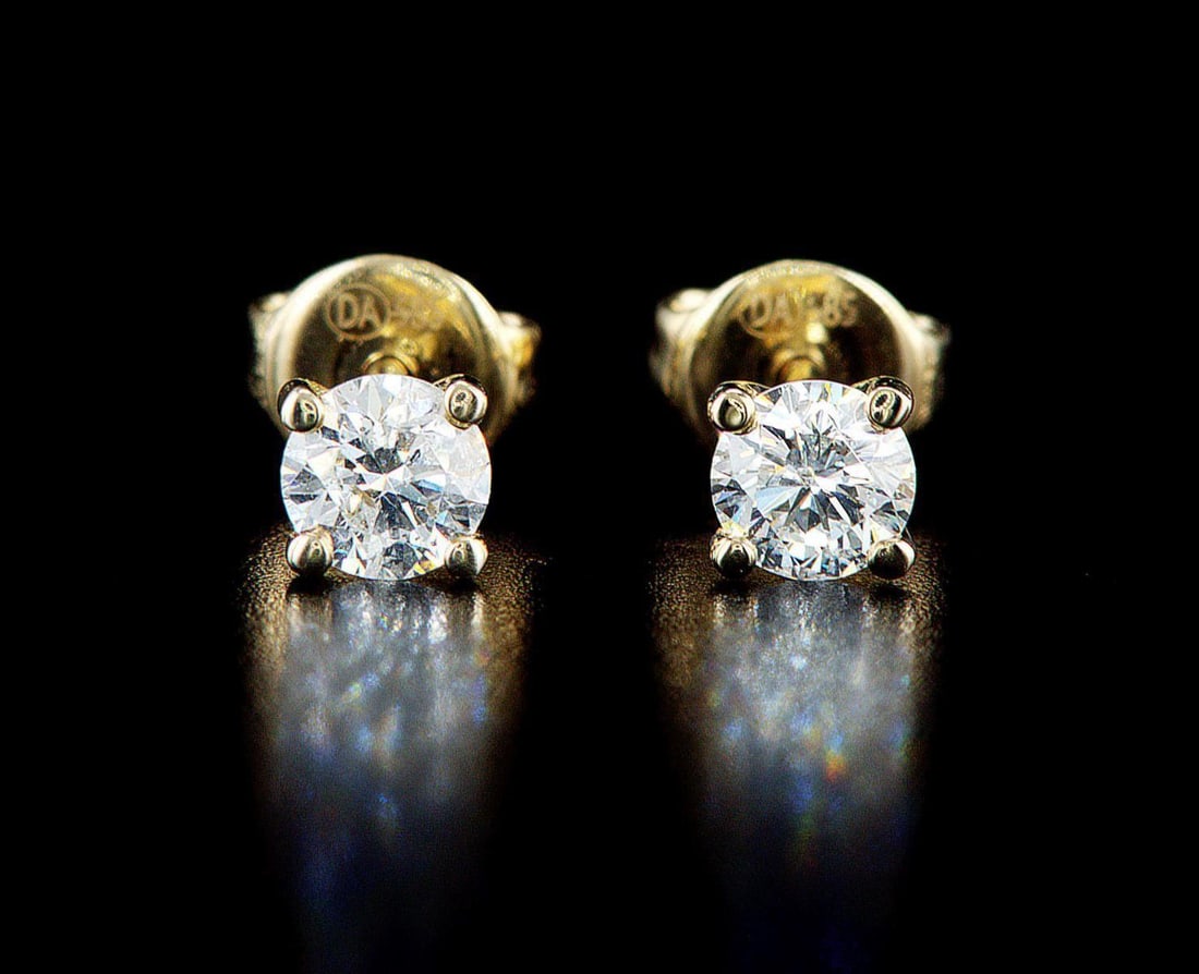 14kt Yellow Gold 0.64ctw Diamond Earrings: 14k yellow gold earrings (14k stamped), each set with one natural diamond. Jewelry Weight: 1.28Grs Total Diamonds Weight: 0.64Cts Main Stones Description: Quantity: 2 Cut and shape: Round Brilliant Ca