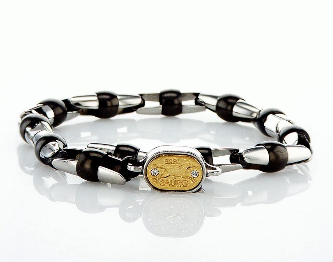 18kt Rose Gold 0.02ctw Diamond Bracelet: One 18K rose gold and stainless steel bracelet for men set with two natural diamonds. Jewelry Weight: 17.01Grs Total Diamonds Weight: 0.02Cts Main Stones Description: Quantity: 2 Cut and shape: Round