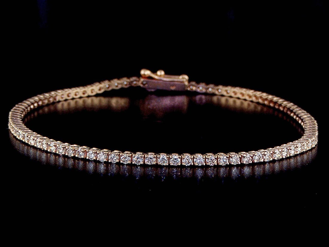 14kt Rose Gold 1.96ctw Diamond Tennis Bracelet: One 14k rose gold bracelet "tennis" (585 stamped) set with natural Diamonds. Natural diamonds description: Cut and shape: Round Brilliant. Total Weight: 1.96 cts. Cut/polish/symmetry: Excellent/Excell