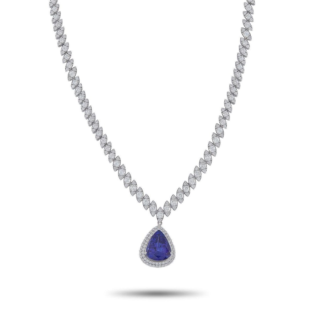 18K WHITE GOLD 10.03CT DIAMOND AND TANZANITE NECKLACE: This breathtaking necklace is worthy of even your most special occasions. Diamonds with a total weight of 10.03 carats elevate the 16chain. This pieces pendant is adorned with additional Diamond accen