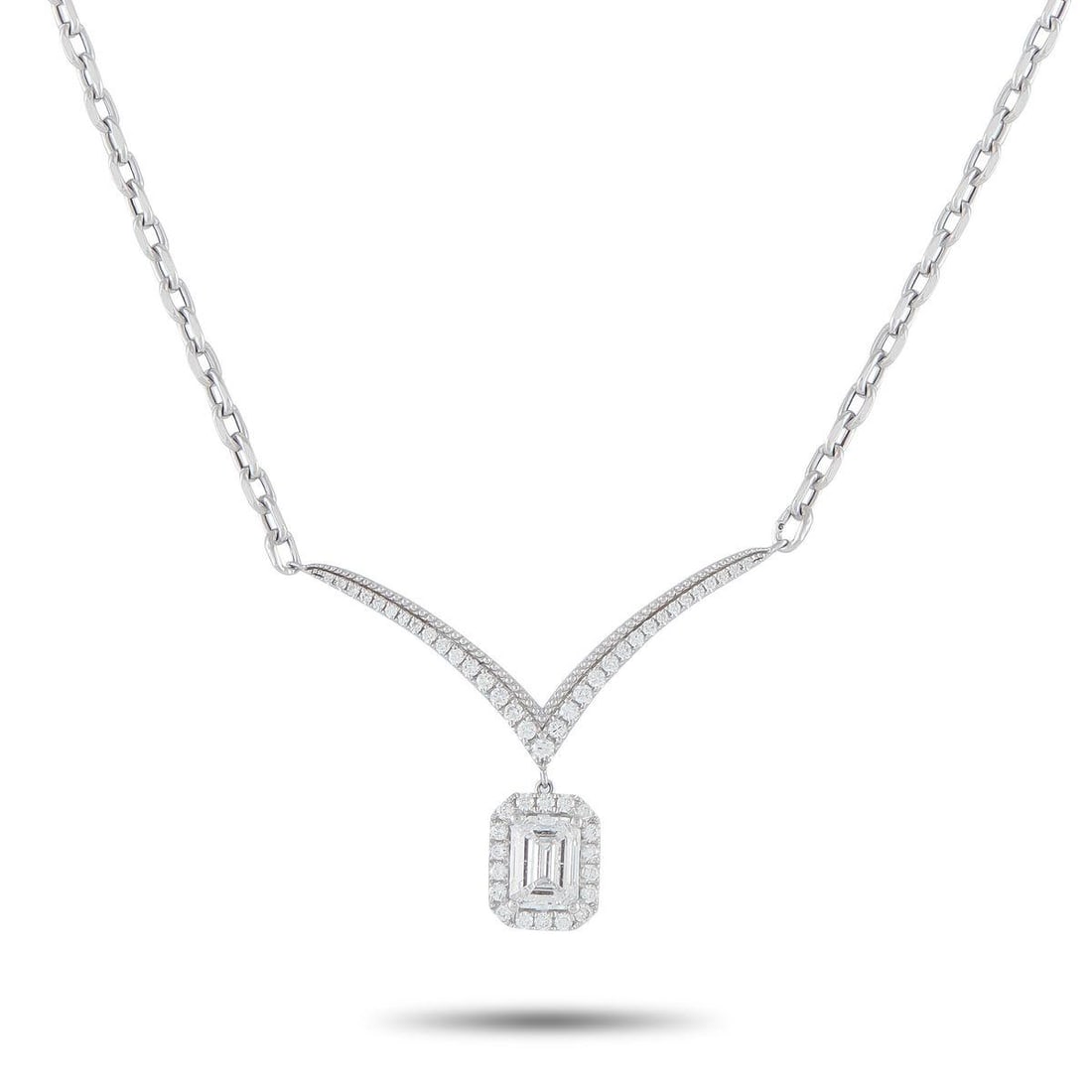 18K WHITE GOLD 1.33CT DIAMOND NECKLACE: A delicate design makes this necklace an exquisite addition to any ensemble. The 1.03 carat Diamond center stone dangles delicately from the sleek pendant, while additional Diamond accents totaling 0.