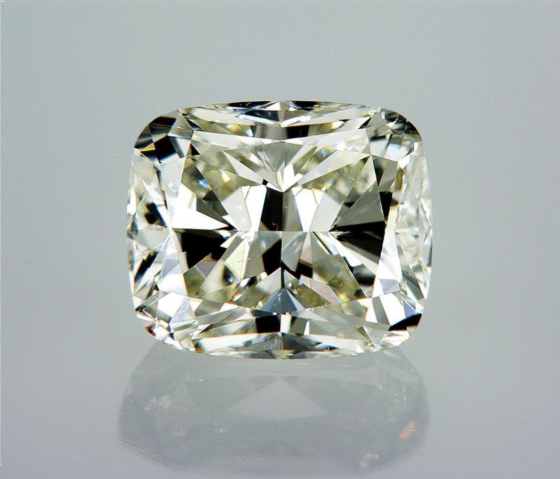Natural 1.5 ct, Color K/VS1 GIA Graded Diamond: Lab/Natural Diamond: Natural Carat Weight: 1.5 Color Grade: K Clarity Grade: VS1 Model: Cushion Modified Brilliant Fluorescence: None Polish: Excellent Symmetry: Very Good Size: 7.09 x 6.03 x 4.43 Cer