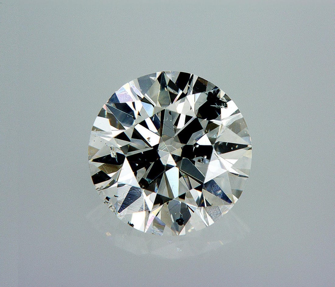 Natural 1 ct, Color G/SI2 GIA Graded Diamond: Lab/Natural Diamond: Natural Carat Weight: 1 Color Grade: G Clarity Grade: SI2 Model: Round Brilliant Fluorescence: Faint Polish: Very Good Symmetry: Very Good Cut Grade: Excellent Size: 6.44 - 6.49 x