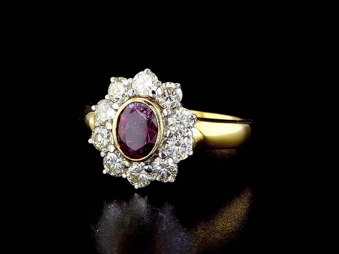 18kt Yellow Gold 1.3ctw Diamond Ring: One 18k yellow gold ring (18k stamped), set with one center tourmaline and small natural diamonds around. Gemstone description: Gem Variety: Tourmaline. Cut and Shape: Oval. Quantity: 1 pcs. Total Wei