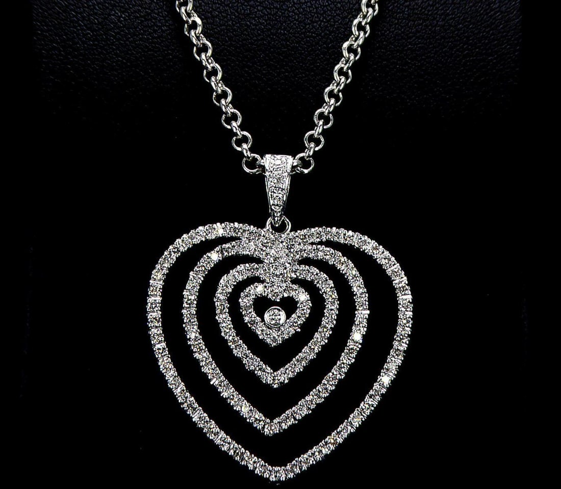 18kt White Gold 0.84ctw Diamond Pendant: One 18k white gold pendant (18k stamped), set with small natural diamonds. Jewelry Weight: 5.62Grs Total Diamonds Weight: 0.84Cts Main Stones Description: Cut and shape: Round Brilliant Carats Weight:
