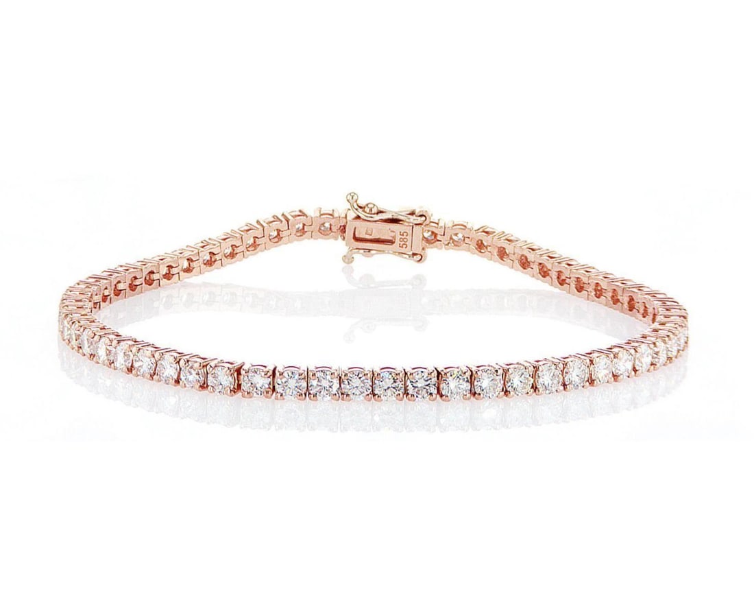 14kt Rose Gold 4.92ctw Diamond Ring: One 14k rose gold ring, set with natural diamond. Jewelry Weight: 9.51Grs Total Diamonds Weight: 4.92Cts Main Stones Description: Quantity: 59 Cut and shape: Round Brilliant Carats Weight: 4.92 Clarit