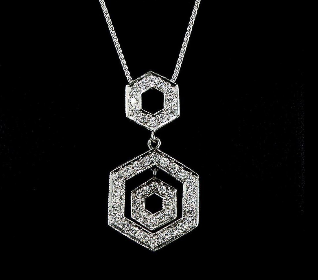14kt White Gold 0.98ctw Diamond Pendant: One 14k white gold pendant with chain (14k stamped), set with small natural diamonds. Jewelry Weight: 5.56Grs Total Diamonds Weight: 0.98Cts Main Stones Description: Cut and shape: Round Brilliant Car