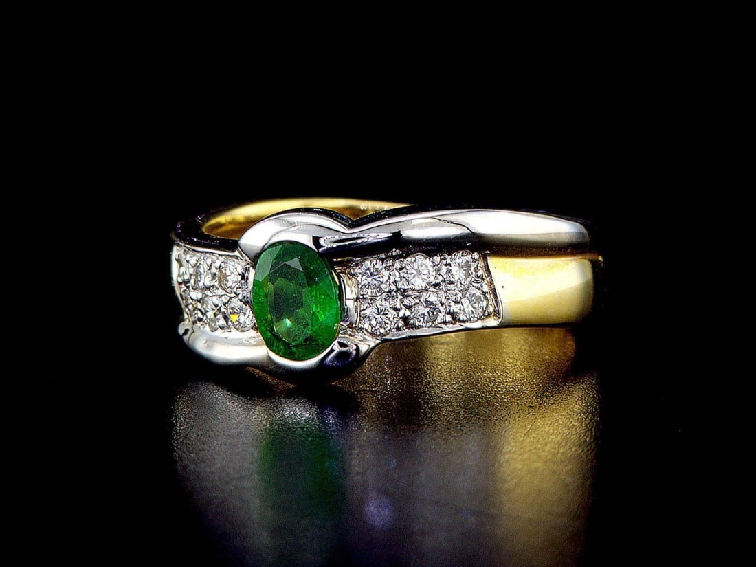 14kt White Gold 0.38ctw Diamond Ring: One 14k white & yellow gold ring, set with one center natural emerald and small natural diamonds on the sides. Gemstone description: Gem Variety: Emerald. Cut and Shape: Oval. Quantity: 1 pcs. Total W