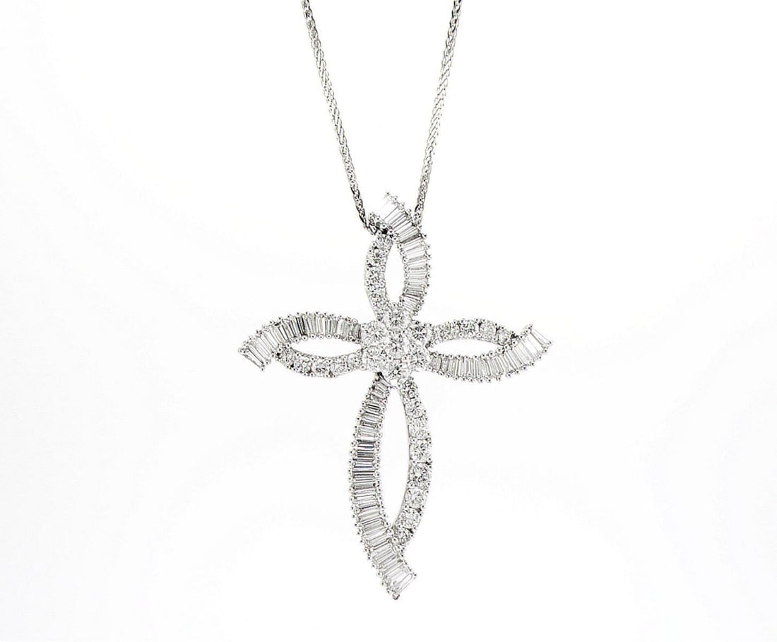 18kt White Gold 2.35ctw Diamond Pendant: One 18k white gold pendant, set with natural diamonds. Jewelry Weight: 7.4Grs Total Diamonds Weight: 2.35Cts Main Stones Description: Quantity: 60 Cut and shape: Baguette Carats Weight: 1.5 Clarity: V