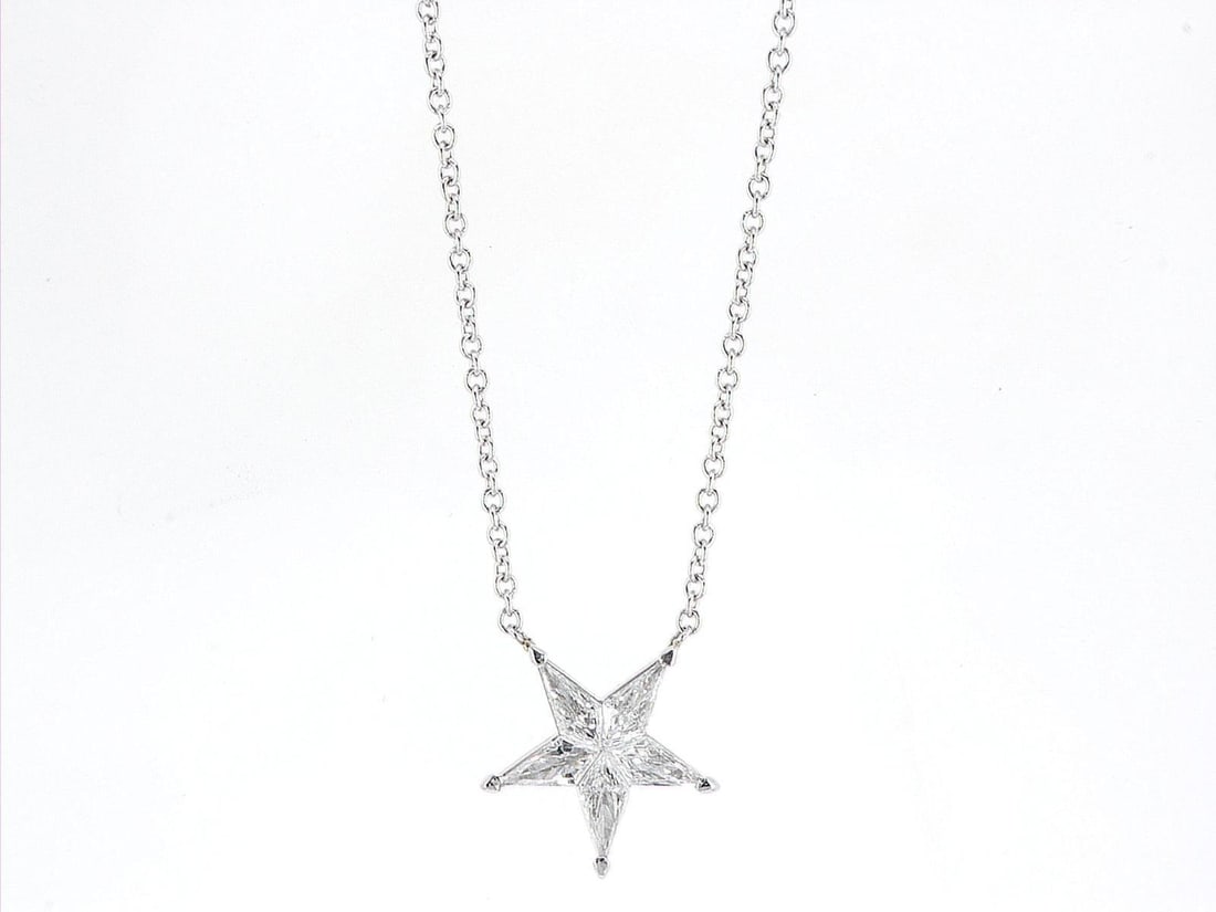 14kt White Gold 0.55ctw Diamond Pendant: One 14k white gold pendant with chain (14k stamped), set with small natural diamonds. Jewelry Weight: 2.46Grs Total Diamonds Weight: 0.55Cts Main Stones Description: Cut and shape: Shield Carats Weigh