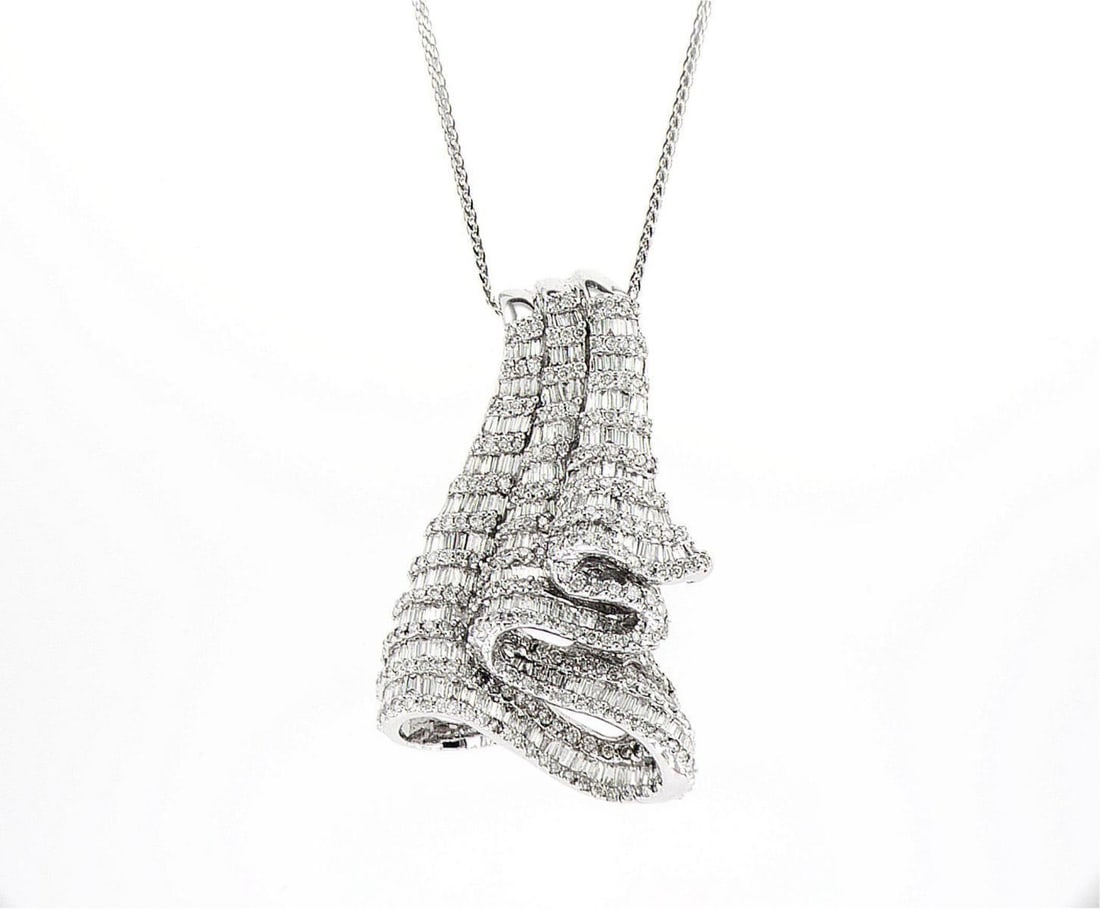 18kt White Gold 3.77ctw Diamond Pendant: One 18k white gold pendant, set with natural diamonds. Jewelry Weight: 15.18Grs Total Diamonds Weight: 3.77Cts Main Stones Description: Quantity: 290 Cut and shape: Baguette Carats Weight: 2.9 Clarity