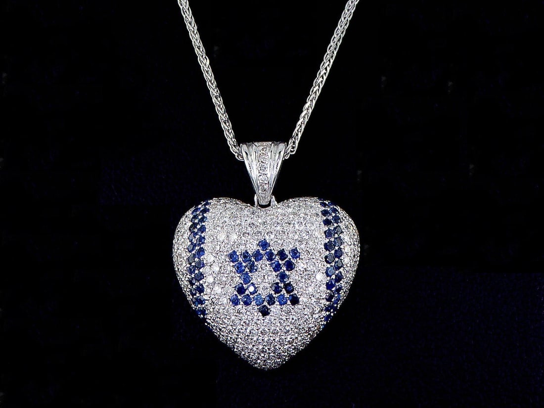 14kt White Gold 1.12ctw Diamond Pendant: One 14k white gold pendant with chain (14k stamped), set with small sapphires & natural diamonds. Natural diamonds description: Cut and shape: Round Brilliant. Total Weight: 1.12 cts. Cut/Polish/Symme