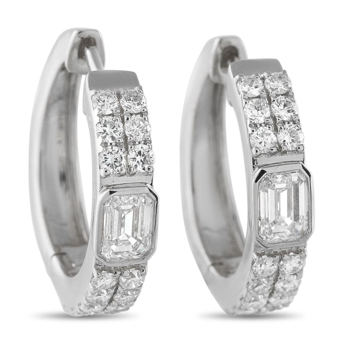 18K WHITE GOLD 1.60CT DIAMOND HUGGIE HOOP EARRINGS: These 18K white gold huggie hoops are designed for everyday ease with a touch of brilliance. Two rows of petite round diamonds run along each hoop's front. At the center, a single step-cut diamond sit
