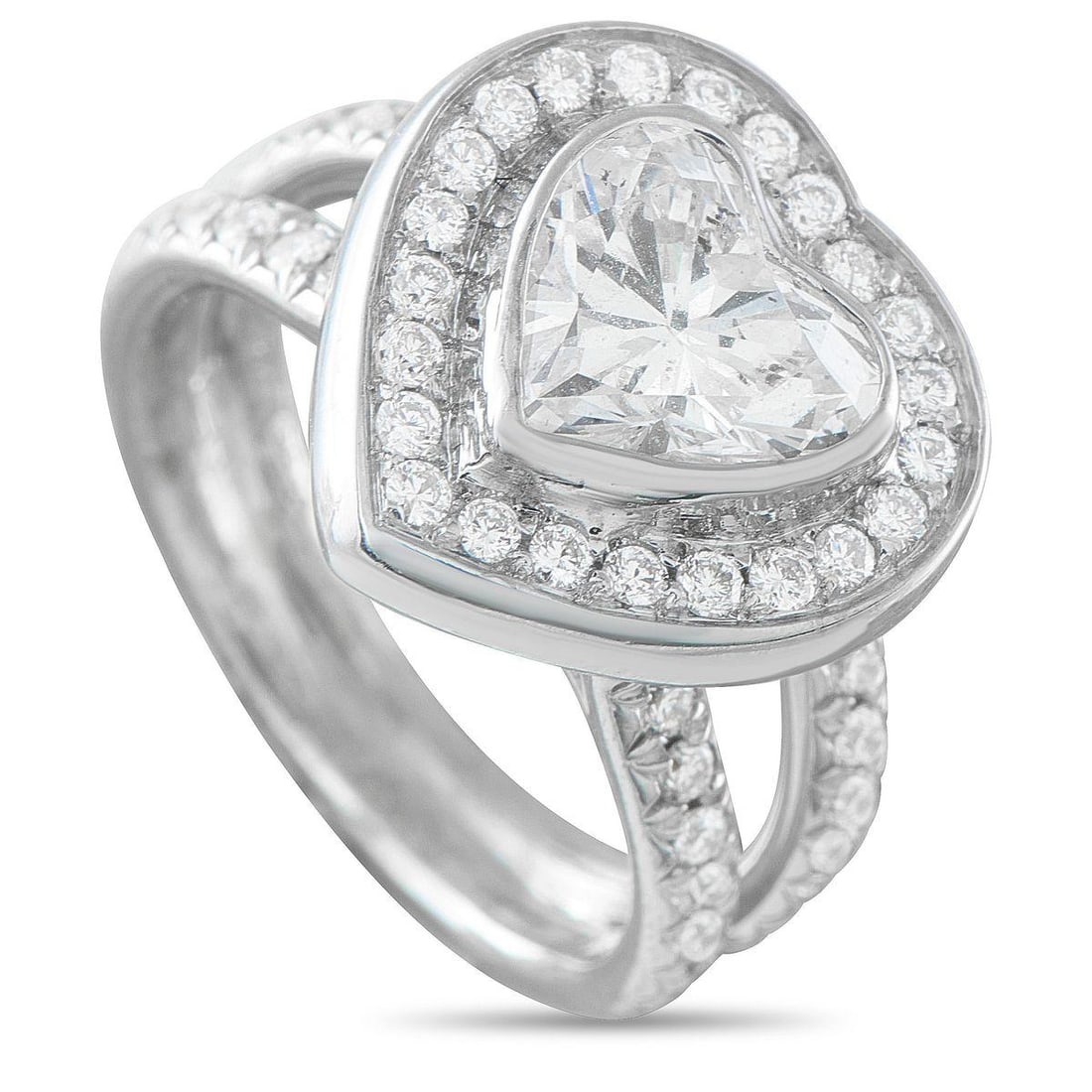 18K WHITE GOLD 2.22CT DIAMOND HEART RING: A symbol of love where space plays a defining role. The ring is crafted in 18K white gold with a wide split shank at the shoulders, its edges traced with diamonds that lead toward the center. The hear