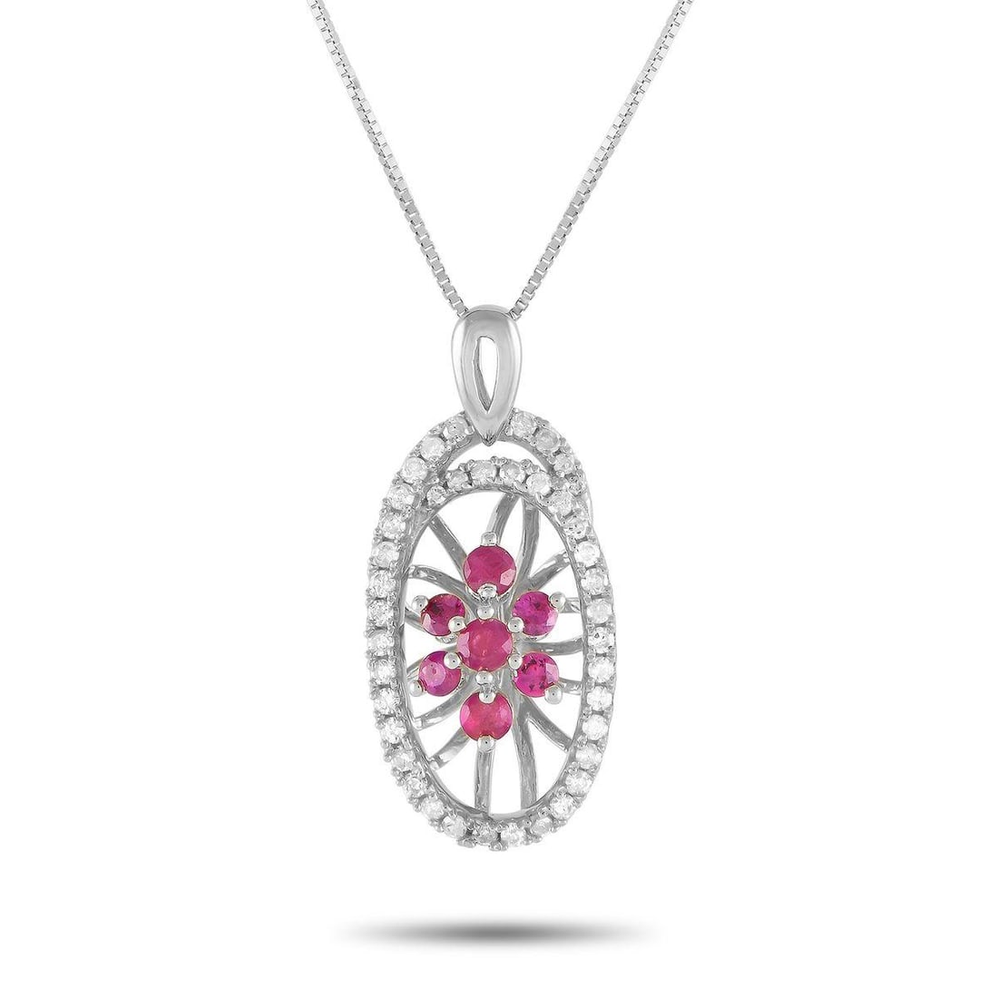 14K WHITE GOLD 0.22CT DIAMOND AND RUBY NECKLACE: This luxury necklace will continually capture your imagination. Suspended from an 18 box chain, youll find an intricate 14K white gold pendant measuring 0.85 long by 0.45 wide. Its elevated by colorfu