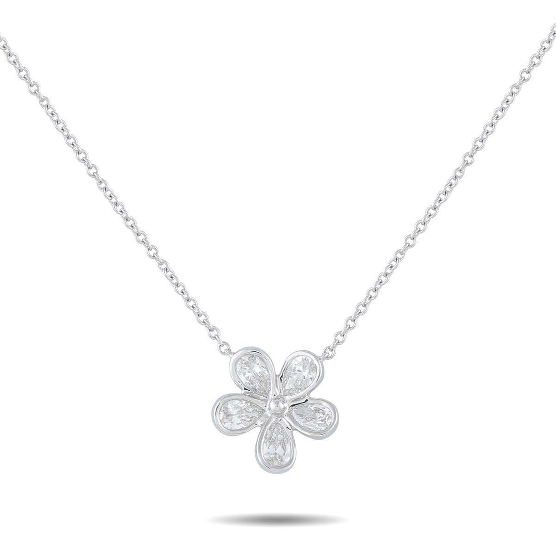 18K WHITE GOLD 1.25CT DIAMOND FLOWER NECKLACE: Set on a fine white gold chain, this necklace places focus on a fluid floral pendant. Five pear-cut diamonds serve as petals, each enclosed in a slim bezel that traces the stone's shape in a continuou