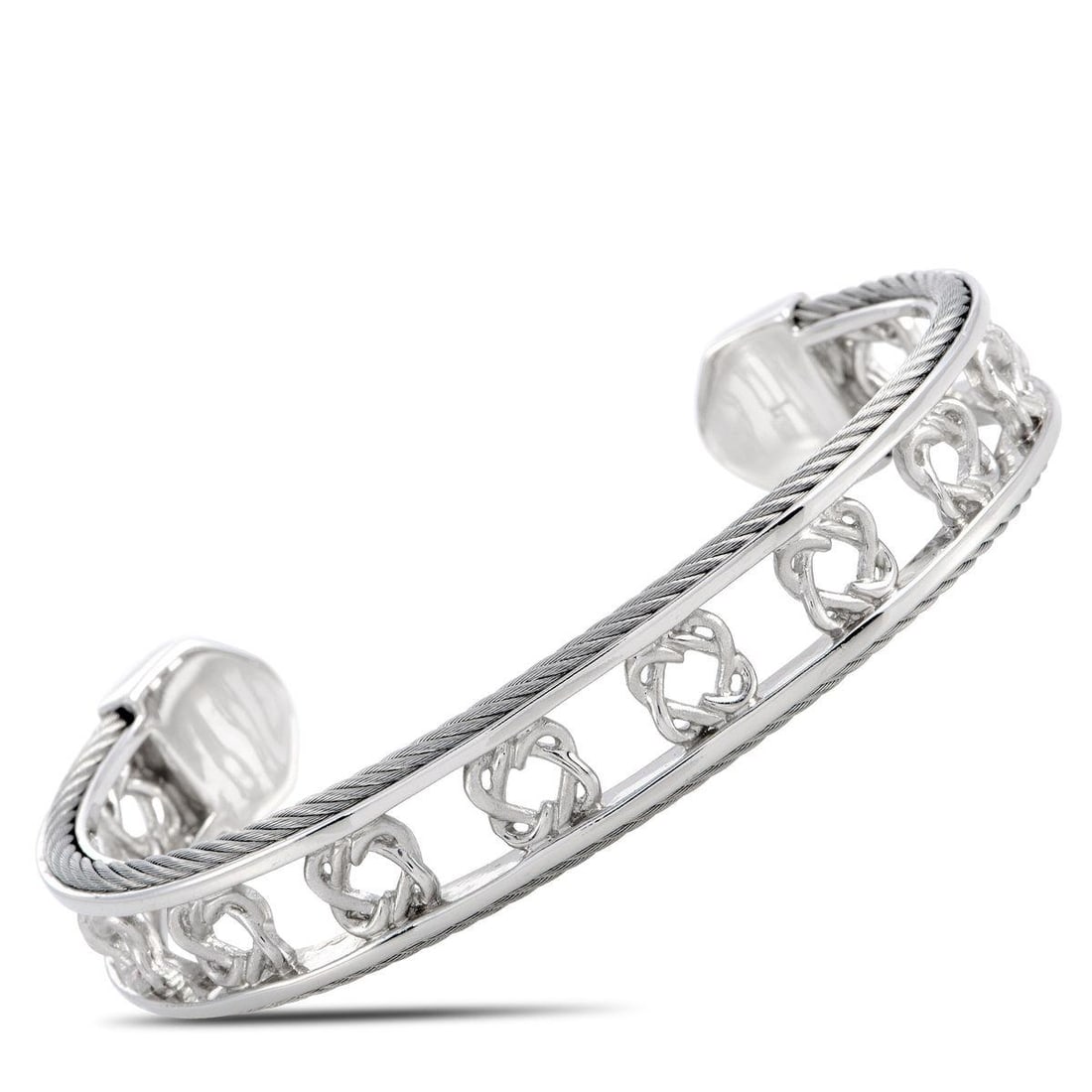 CHARRIOL HEART TO HEART STERLING SILVER BANGLE BRACELET SIZE LARGE: The Charriol Heart to Heart bracelet is crafted from sterling silver and weighs 25.2 grams, measuring 7.85 in length and 2.50 in diameter.This jewelry piece is offered in brand new condition and inclu